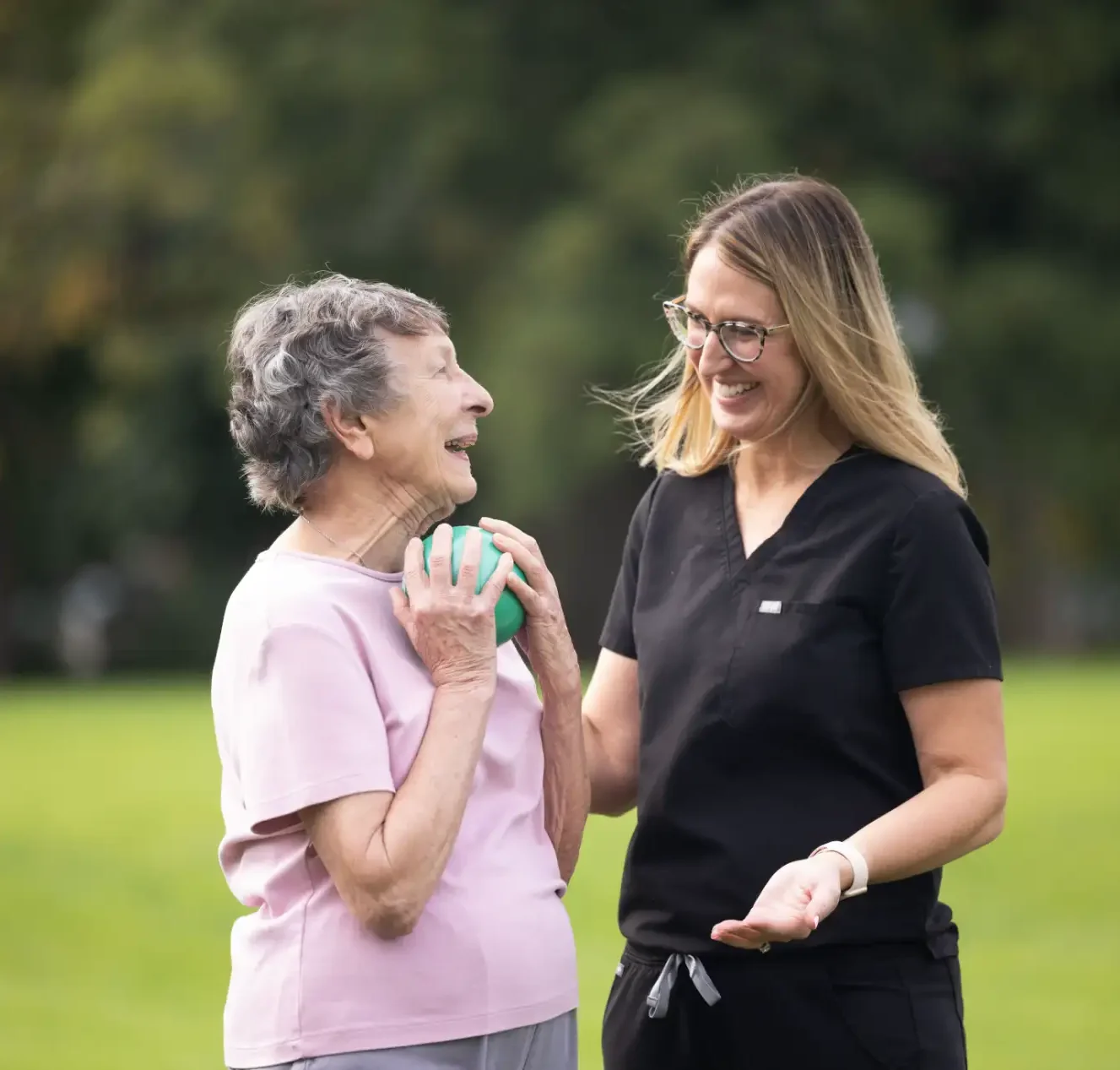 a woman assisting an old women
